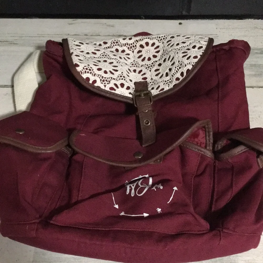 Burgundy cloth back pack white handles & white crochet flower overlay on flap